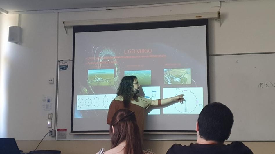 group member giving a talk on LIGO and VIRGO
